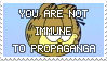 a stamp of garfield's head, with the text:'YOU ARE NOT IMMUNE TO PROPAGANDA' superimposed on top of it.